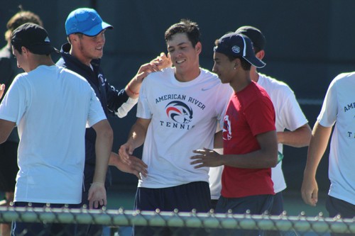 American River College's Seppi Capaul is congratulated by teammates following his win over Jacob Starbo of Foothill College during the NorCal Tournament Final on April 16, 2016 at ARC. Capaul won his match 6-1, 6-3 to make ARC NorCal Champions. (Photo by Mack Ervin III)