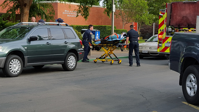 An American River College student involved in a physical altercation on Wednesday is transported by way of a stretcher to an ambulance in front of the administration building at ARC. Both students involved in the altercation declined to press charges. (Photo by Matthew Peirson)