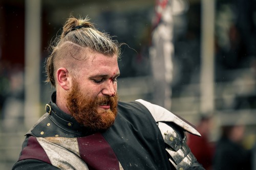 Blood trickles down the nose of a member of the USA Knights after a fight during the Armored Combat League U.S. National Championship. (Photo by Kyle Elsasser)