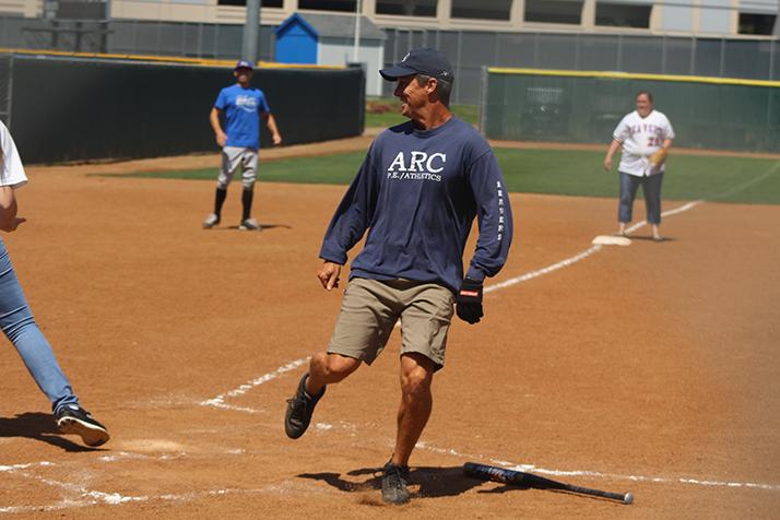 Mens track and field head coach and Faculty player Rick Anderson looks back after scoring a run during the Classified vs. Faculty softball game on April 29, 2016 at ARC. Faculty won the game 24-9. (Photo by Mack Ervin III)