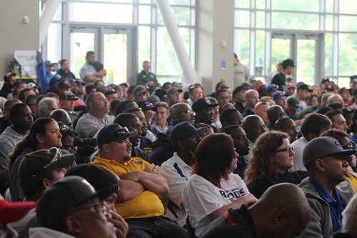 Audience members look on as Denver Broncos offensive line coach Clancy Barone gives the keynote speech at the Linemen Win Games (LWG) coaches clinic on May 21, 2016 at American River College. Hundreds of line coaches and youth football coaches filled the Student Center to listen to the Super Bowl champion coach. (Photo by Mack Ervin III)