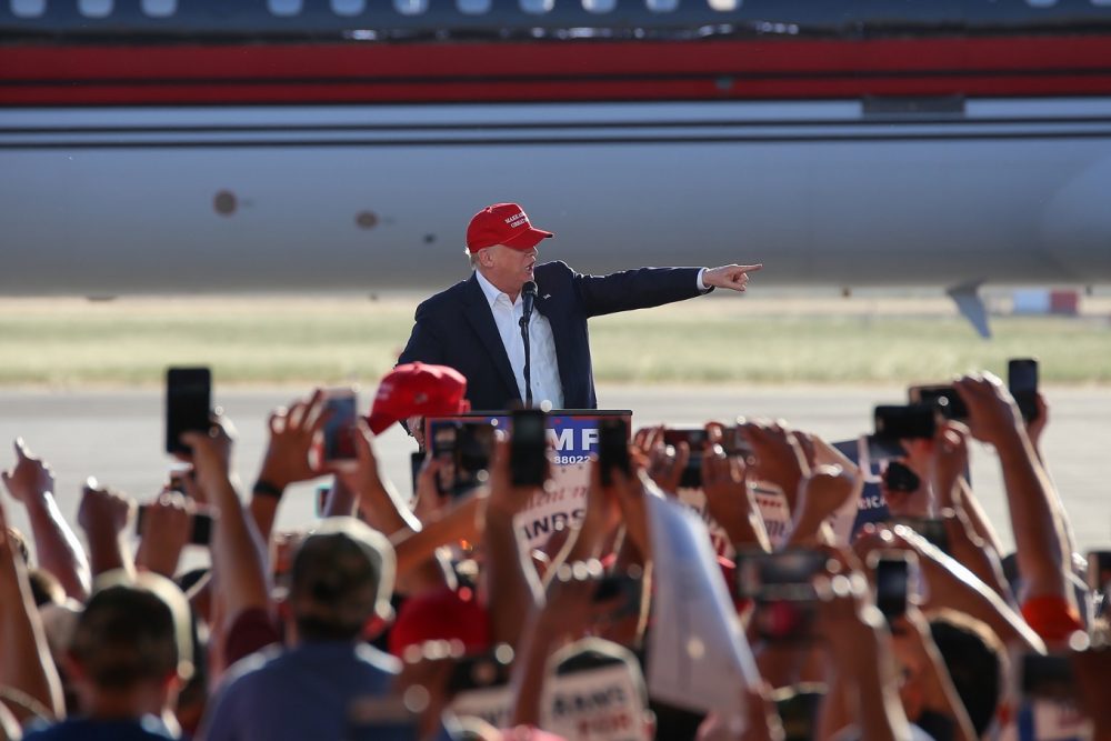 Presumptive GOP nominee Donald Trump points to members of the audience during his rally in Sacramento, California on June 1, 2016. (Photo by Kyle Elsasser)