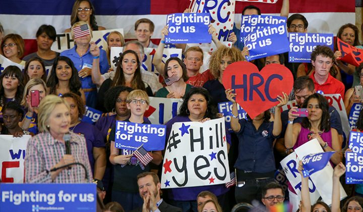 Hillary Clinton supporters hold up signs during Clinton’s campaign event at Sacramento City College in Sacramento, California on June 5, 2016. (Photo by Kyle Elsasser)