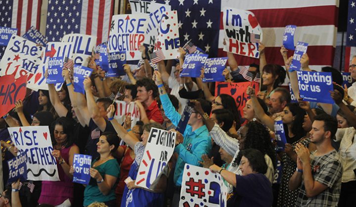 Supporters of democratic presidential candidate Hillary Clinton hold up signs and cheer during a rally event in Sacramento California on June 5, 2016. Clinton was campaiging ahead of California’s presidential primary on June 7. (Photo by Mack Ervin III)