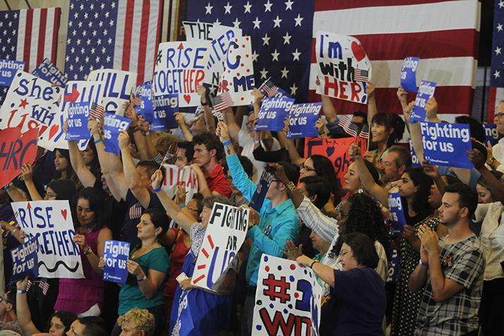 Supporters of democratic presidential candidate Hillary Clinton hold up signs and cheer during a rally event in Sacramento California on June 5, 2016. Clinton was campaiging ahead of Californias presidential primary on June 7. (Photo by Mack Ervin III)