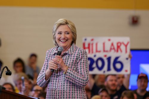 Presidential candidate Hillary Clinton smiles at  the crowd during her campaign event at Sacramento City College in Sacramento, California on June 5, 2016. (Photo by Kyle Elsasser)