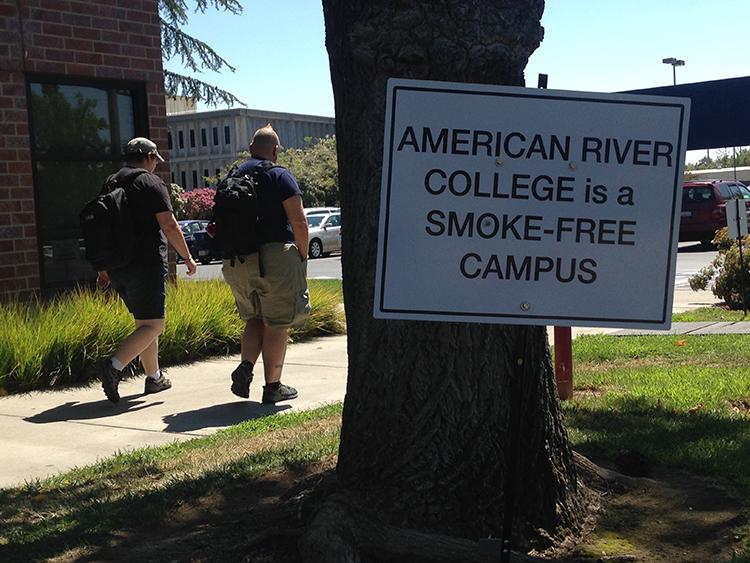 Leah+Cato+%28left%29+and+Ryal+Strom+%28right%29+walk+back+to+class+after+their+cigarette+break+at+the+edge+of+the+campus.+American+River+College+has+been+smoke-free+since+January+1%2C+2016+and+does+not+provide+smoking+sections.+%28Photo+by+Robert+Hansen%29