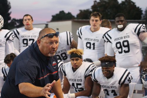 Amerrican River College defensive coordinator Lou Baiz talks to the players following ARC's 23-20 win against Diablo Valley College n Friday Sep. 1 at DVC. ARC allowed 324 yards during the game. (Photo by Lao Broadway)