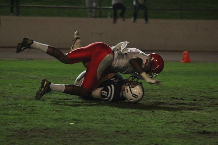 American River College quarterback Griffin Dahn is sacked by City College of San Fransisco defensive back Bobo Leota during a game on Sept. 17 at ARC. Dahn finished 11-28 with 173 yards during the 51-36 loss. (Photo by Mack Ervin III)