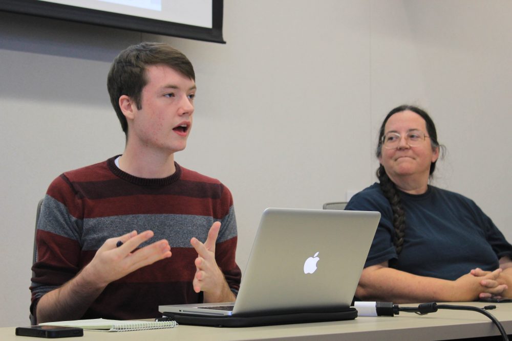 Clubs and Events Board (CAEB) President Justin Nicholson (left) with Teresa Bergman (right) discusses the agenda for the Sept. 6, 2016 CAEB meeting in the board room. (Photo by Robert Hansen)