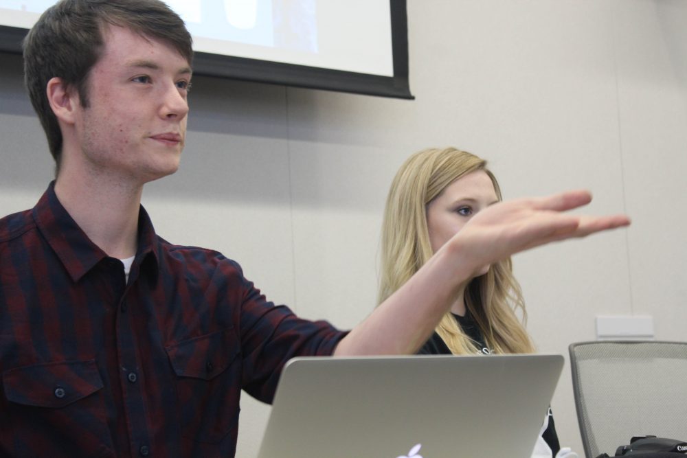 CAEB President Justin Nocholson (left) listens with Ashlee Nicholson (right) to introductions from the board at the Sept. 20, 2016 meeting in the board room. (Photo by Robert Hansen)