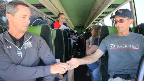 Coach Rick Anderson for the men's cross country team (right) and assistant coach Jim Howard sitting upfront on the team's travel bus for their cross country meet at the racecourse, Lou Vasquez, in Golden Gate Park, San Francisco on Sept. 22. (Photo by Cheyenne Drury)