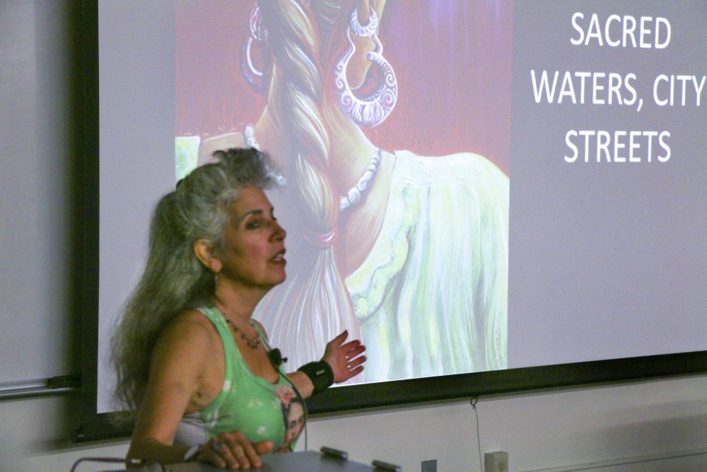 Juana Alicia delivers her presentation at American River College (Photo by James Saling)