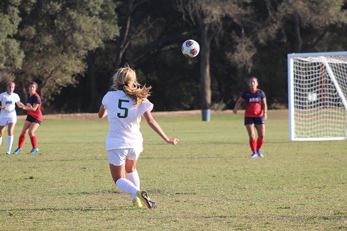 Diablo Valley College defender Zoe Ramer crosses the ball into the box from a free kick during a game against American River College on Oct. 7, 2016 at ARC. ARC lost 3-0. (Photo by Mack Ervin III)