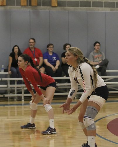 Defensive Specialist Emily Dzubak and Outside Hitter Kaitlin Meyer stand in a ready position during the game against MJC on Sept. 28, Arc won 3 sets to 0. (Photo by Laodicea Broadway)