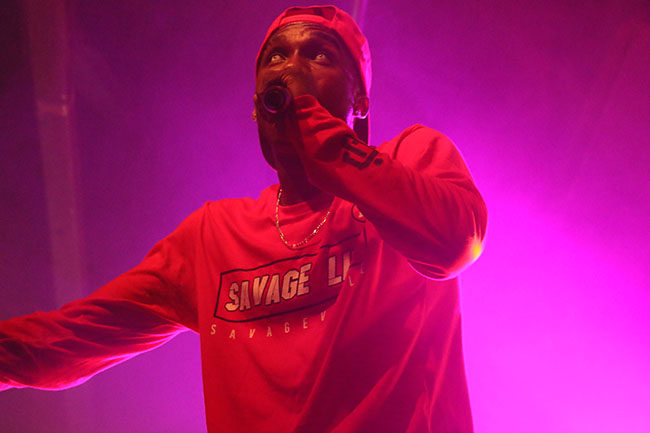 Hopsin performs on stage for his tour “SavageVille,” at Ace of Spades in downtown Sacramento 1417 R St, on Sat. Oct. 8. The rapper demonstrated his spontaneity when he jumped off of the stage, and with the support of his fans, stood up and continued to rap. (Photo by Cheyenne Drury)