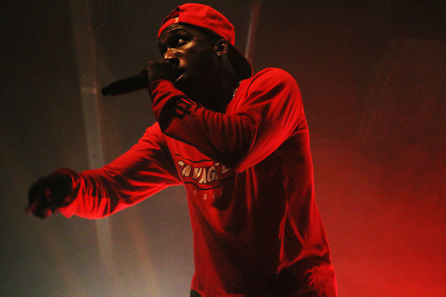 Hopsin performs on stage for his tour “SavageVille,” at Ace of Spades in downtown Sacramento 1417 R St, on Sat. Oct. 8. The rapper demonstrated his spontaneity when he jumped off of the stage, and with the support of his fans, stood up and continued to rap. (Photo by Cheyenne Drury)