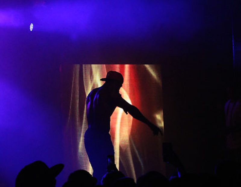 Hopsin performs on stage for his tour “SavageVille,” at Ace of Spades in downtown Sacramento 1417 R St, on Sat. Oct. 8. The rapper demonstrated his spontaneity when he jumped off of the stage, and with the support of his fans, stood up and continued to rap. (Photo by Cheyenne Drury)