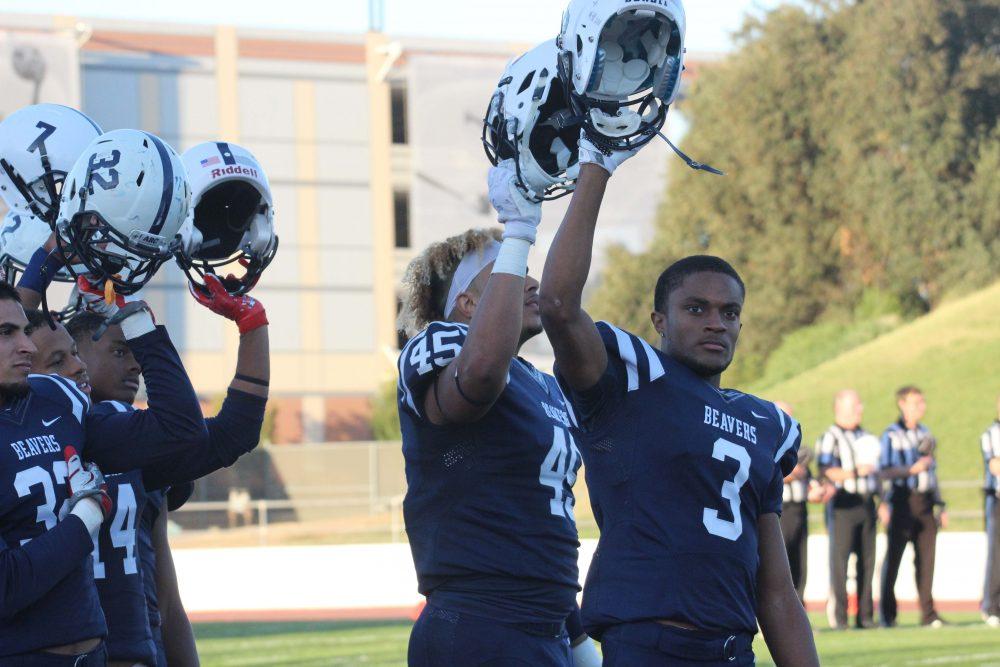 American River College Beavers, Damen Wheeler, Jr. Daliceo Calloway, Moises Valcarcel, and Anthony Luke raise their helmets during the game against San Mateo on Oct. 1. 
(photo by Lidiya Grib)
