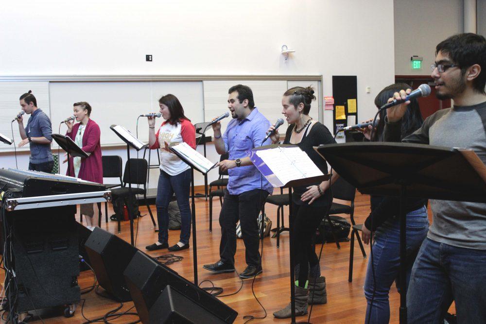 The ARC Vocal Jazz Ensemble singers Cody Quackenbush, Madalyn Parker, Jenna Magaziner, Gabe Catabran, Kate Janzen, Serena Chao and Daniel Avanto rehearse for the national Jazz Education Network that they will attend in New Orleans in January. (Photo by Lidiya Grib)