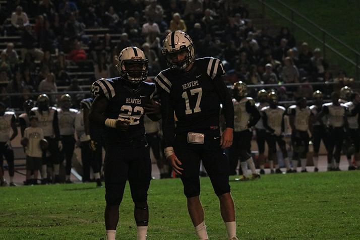 ARC quarterback Chris Guillen and running back Ce’von Mitcell-Ford talk before a play against Butte College on Nov. 5, 2016. ARC lost 21-14 in double overtime. (Photo by Mike Yun)