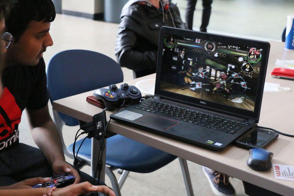 ARC Student Ash Pal plays  a multiplayer fighting game called Skulls Girls. with his friends. (Photo by Mychael Jones)