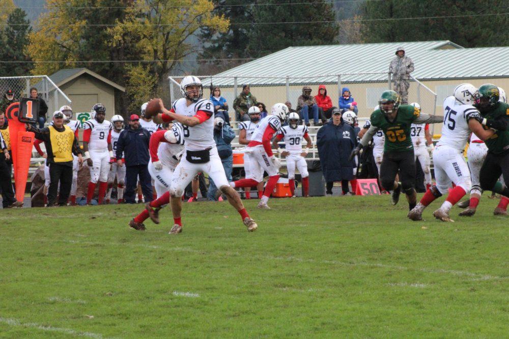 Quaterback Griffim Dahn throws the ball during a game against Feather River College on Oct. 29. (photo by Mike Yun)