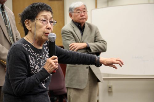 Reiko Nagumo (left) speaks about her experience living in Japanese internment camps during WWII with Lester Ouchida (right) to ARC students in Reaf 160 on Nov. 22, 2016. (Photo by Robert Hansen)