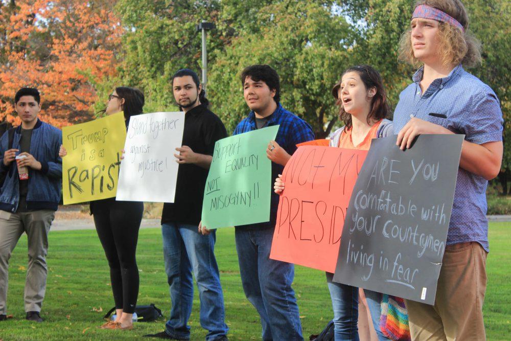 Organizer Julia Stimson (second from right) and other ARC students held a protest against President-elect Donald Trump in front of the ARC Library on Nov. 10. Many students gathered around the protestors, some even argued with the protestors for Trumps side. (Photo by Jared Smith)