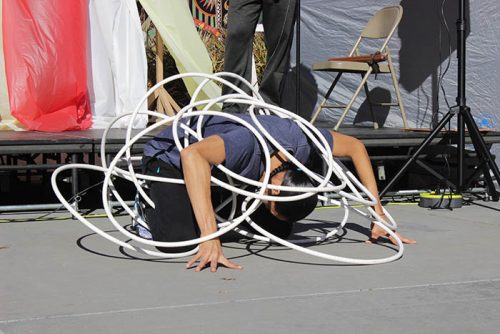 Indigenous choreographer and performer, Micco Sampson, performs at ARC in the quad. He performed hoop dancing, which is a traditional form of dancing that has been passed down in many Native American tribes. (Photo by Cheyenne Drury)