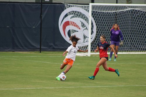 Cosumnes River College defender Averen Calvin attempts to cross the ball into a teammate while being chased by an ARC defender during a game on Oct. 28, 2016. ARC lost 2-0. (Photo by Mack Ervin III)