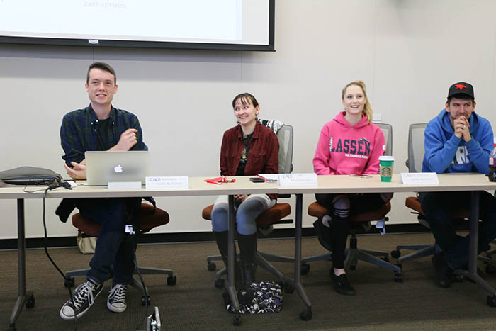 From left to right CAEB Pres. Justin Nicholson, Vice Pres. Mary Stedman, Director of Activities Ashlee Nicholson, Director of Finance Bryan Stalker laugh during their Nov. 8 meeting. They were discussed plans for the upcoming Club Day on Nov. 17. (Photo by Mychael Jones)