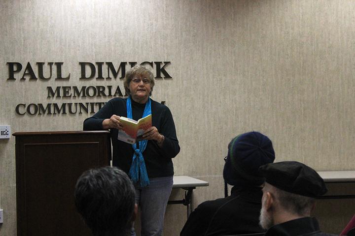 ARC professor Lois Ann Abraham reading from her newly published book “Tina Goes to Heaven” at Arden Dimick library on Dec. 3. (Photo by Lidiya Grib)