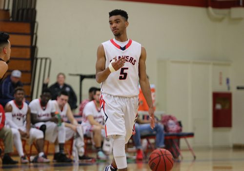 American River College guard Everett Campbell dribbles the ball at the top of the key during a division game against Sacramento City College on Feb. 16, 2017 at ARC. ARC lost 95-74. (Photo by Cheyenne Drury)