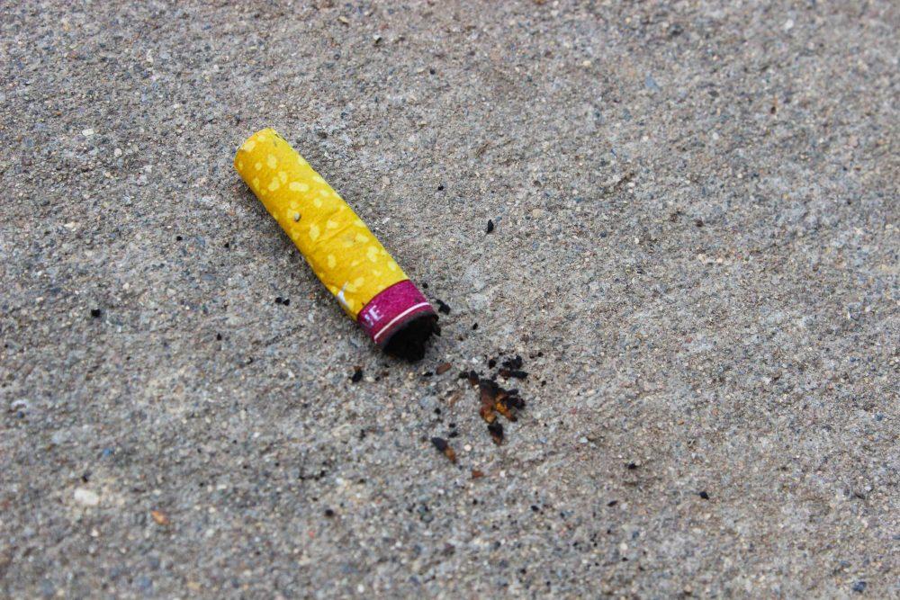 Cigarette butt left on campus. Due to ARCs ban on smoking, students question where to smoke. (Photo by Lidiya Grib)