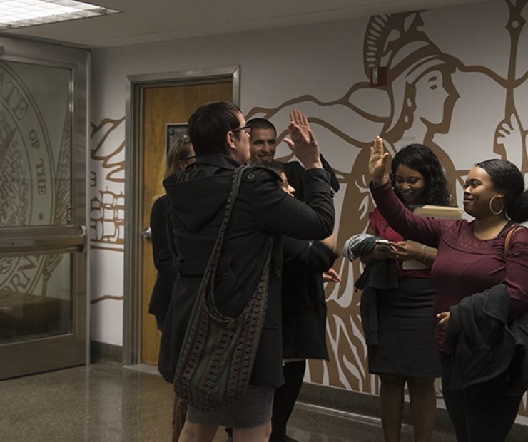 The student senators congragulate one another after their meeting with Amanda Kirchner. They are now looking for other potential assemblymembers to lobby. (Photo by Luis Gael Jimenez)