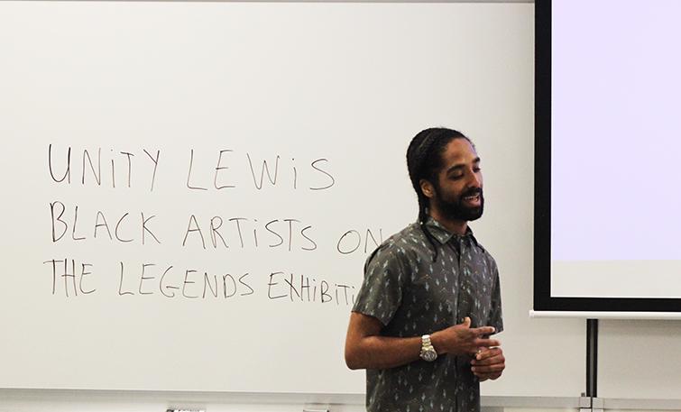 Unity Lewis gives a lecture on the role his grandmother played in the Black Artist movement. Lewis gave the lecture in fine and applied arts room 505 on March 15. (Photo by Jared Smith)