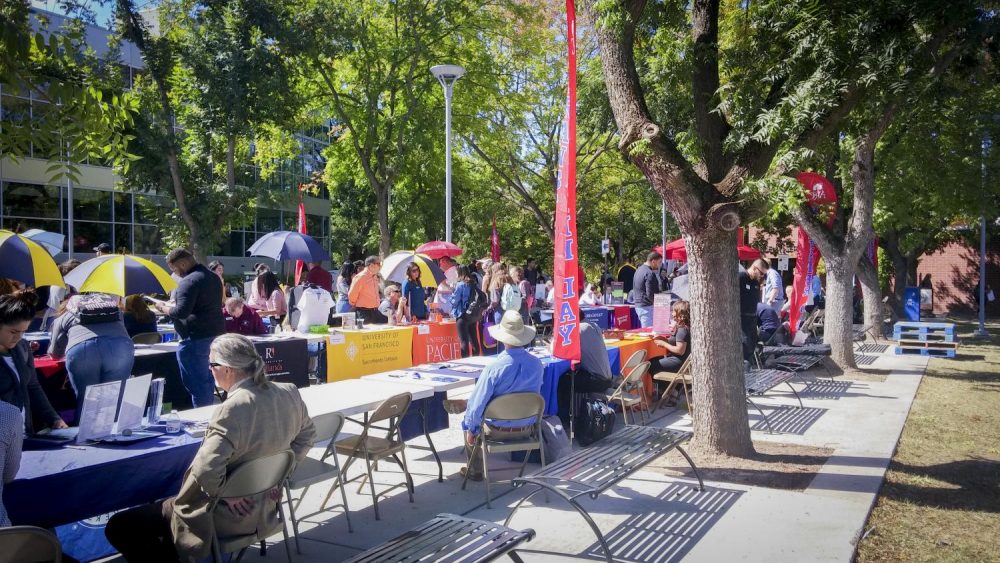 College booths are set up on Transfer Day at American River College in Sacramento, California on Sept. 21, 2017. (Photo by John Ennis)