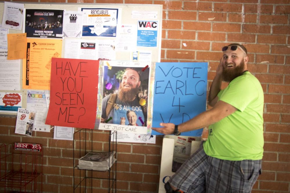 Earl Crouchley III stands by his campaign poster in the Liberal Arts Hallway at American River College in Sacramento, California on Sept. 26. Crouchley is running for Student Senate vice president. (Photo by Ashley Hayes-Stone)