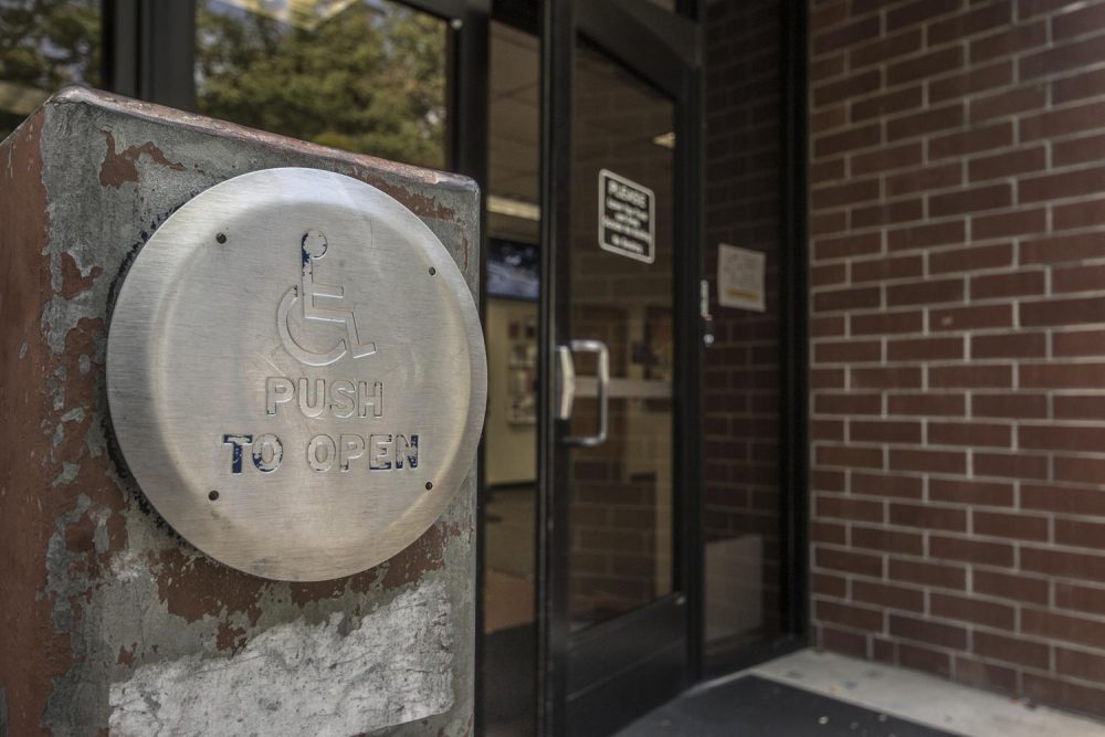 An American with Disabilities Act-compliant door opener shows heavy signs of wear and tear at American River College in Sacramento, California on Sept. 8, 2017. Many of the ADA-compliant door openers around ARC’s campus have seen excessive use and some of them are unusable. (Photo by Luis Gael Jimenez)