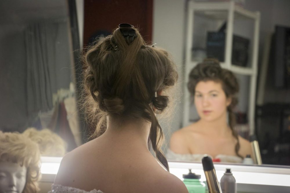 Actress Elizabeth Garbe gets ready for a dress rehearsal for American River Colleges production of Beauty and the Beast. (Photo by Ashley Hayes-Stone)