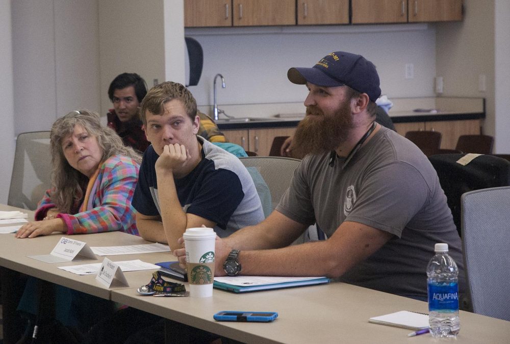 Student Senator Earl Crouchley III (right) delivers a speech to ASB arguing for a $1,000 donation to the AR Review on Nov. 9. (Photo by Brienna Edwards)