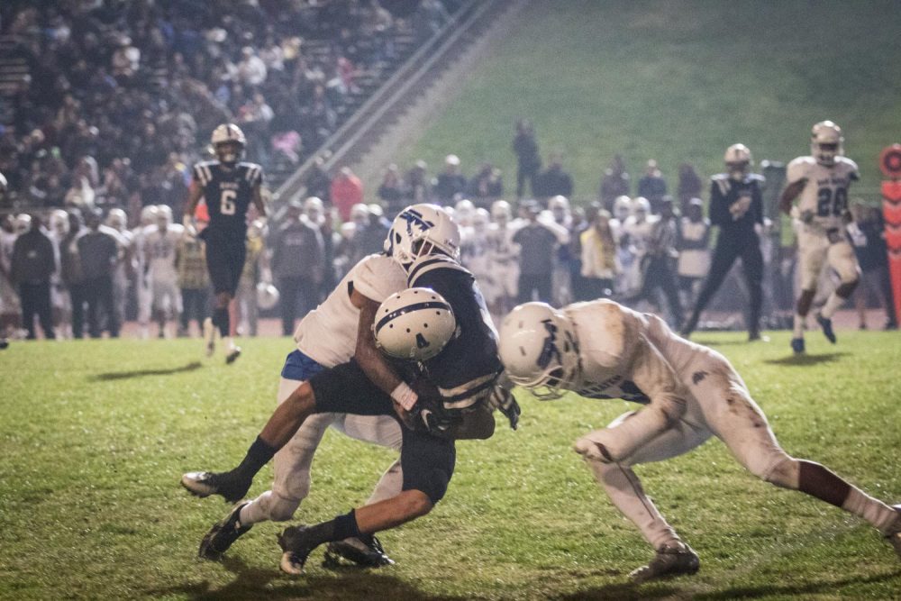 ARC+quarterback+Hunter+Rodrigues+is+tackled+down+by+San+Mateo+defenders+while+attempting+to+run+the+ball+at+American+River+College+on+Nov.+25.+%28Photo+by+Ashley+Hayes-Stone%29