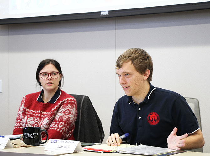 Student Senate President Deborah Hernandez, CAEB President Mariana Topich and CAEB Commissioner of Finance Jacob Kohl at the November 28, 2017 CAEB meeting. (Photo by John Ennis)