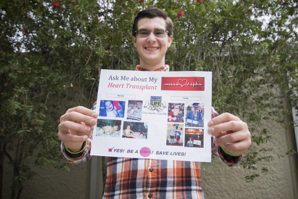 Chris Sutton holds a flyer that he uses to convince people to consider organ donations. Sutton was the recipient of an organ donation at the age of 2 that saved his life. (Photo by Ashley Hayes-Stone)