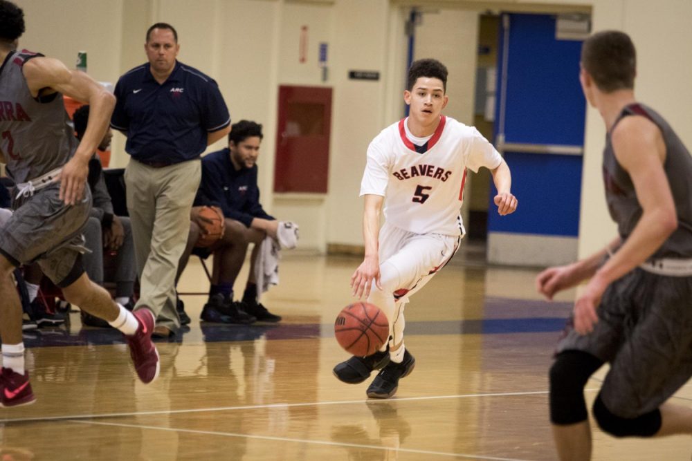 American River College guard Lawrence Smith brings the ball up court during a game against Sierra College on Jan. 16 at American River College in Sacramento, California. (photo by Ashley Hayes-Stone)