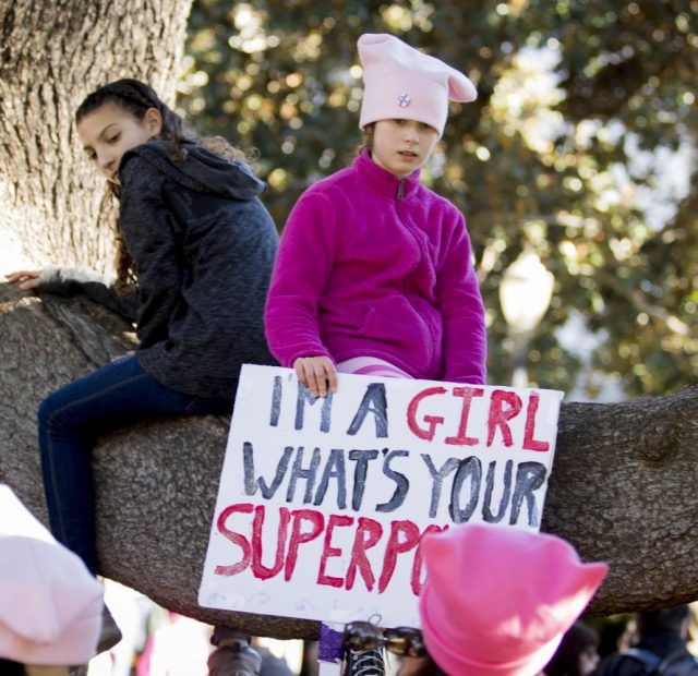 A child poses with her sign at the California State Capitol on Jan. 20, 2018 in Sacramento, California.