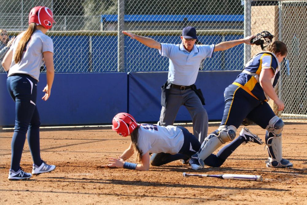 American River College catcher/infielder Rylee Owen is ruled safe at the plate during a doubleheader softball game against Merced College on Jan 27. at ARC. The Beavers won both games with a combined score of 17-1. (Photo by Tracy Holmes)