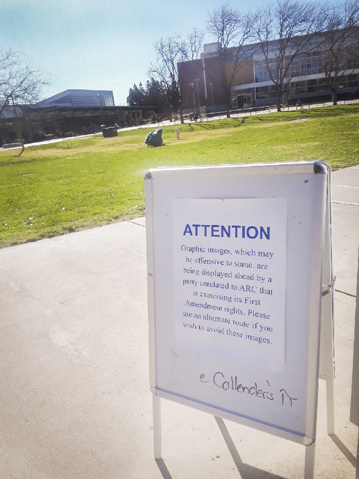 A sign warns students about protesters displaying graphic images on campus on Mar. 5 at American River College. Anti-abortion protesters came to American River College to voice their beliefs to students. (Photo by Brienna Edwards)