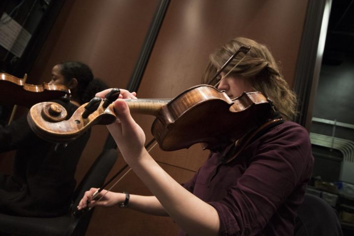 Raluca Ilies plays her violin on Mar. 8 at American River College.(Photo by Ashley Hayes-Stone)